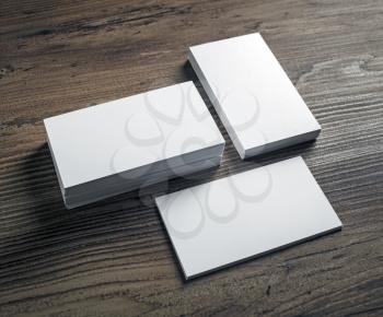 Mockup of blank business cards stack on wooden table background. Template for ID. Mock-up for branding identity.