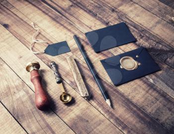 Vintage stationery set. Photo of blank stationery on wooden table background. Mockup for branding identity. ID template.