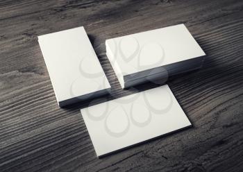 Blank business cards on wood background. Template for ID. Mock up for branding identity.