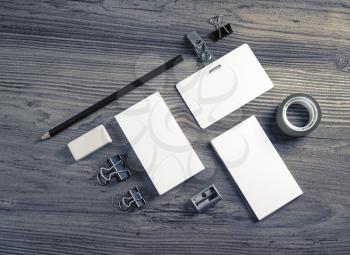 Blank branding template on wooden background. Photo of blank stationery. Mock up for design portfolios. Top view.