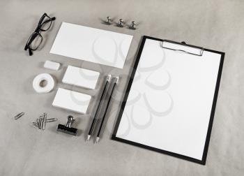 Photo of blank stationery set on craft paper background. Template for placing your design. Mockup for branding identity.