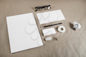 Corporate stationery set on craft paper background. Blank branding mock-up.