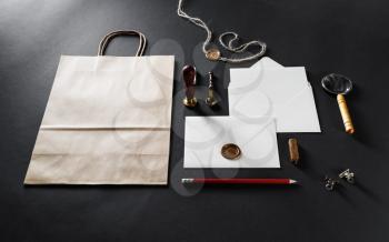 Blank envelopes and stationery set on black paper background. Responsive design template.