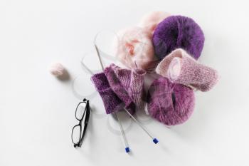 Yarn for knitting. Wool, glasses and knitting needles. Flat lay
