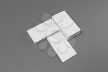 Blank business cards on gray paper background. High size mockup.