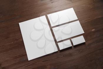 Photo of blank stationery set on wood background. Corporate identity template. Responsive design mockup.