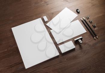 Photo of blank stationery set on wooden background. Corporate identity mock up for placing your design.
