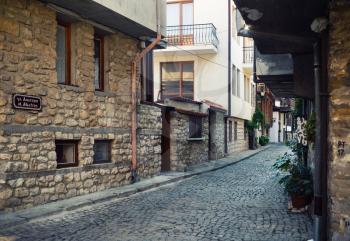 Nesebar, Bulgaria - September 10, 2014: Typical street in old town of Nessebar. Nesebar is an ancient city and one of the major seaside resorts on the Bulgarian Black Sea Coast. UNESCO world heritage site.