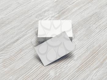 Blank business cards on light wooden background. Mockup for branding identity.