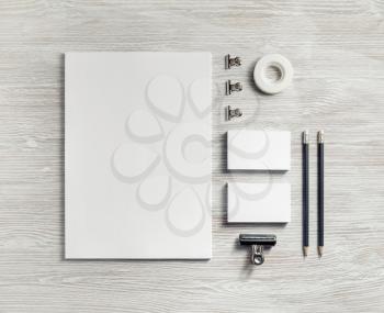 Blank stationery set on light wood table background. Template for branding identity. For graphic designers presentations and portfolios. Flat lay.