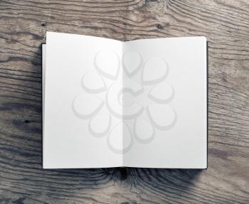 Photo of blank notebook on wooden background. Flat lay.