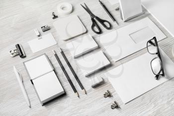 Blank corporate stationery set on light wood table background. Branding mock up. Template for placing your design.