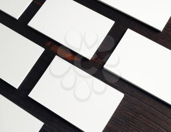 Photo of blank white business cards on wooden background. Copy space for placing your design.