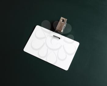 White ID card. Blank security badge on green chalkboard background. Copy space for text.
