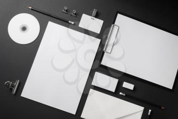 Blank stationery set on black background. Corporate identity template. Mock-up for branding identity. Top view.