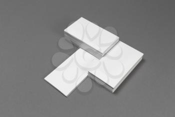 Blank business cards on gray paper background. Mockup for branding identity.