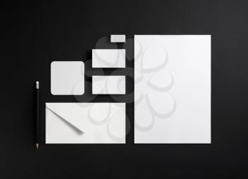 Blank stationery and corporate identity template on black background. Mock-up for ID. Top view.