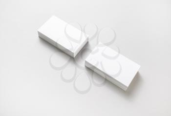 Blank business cards with soft shadows on paper background. Template for ID. Mockup for branding identity.
