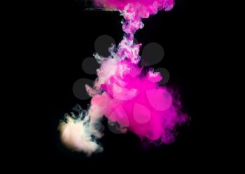Pink and white paint in water on black background.