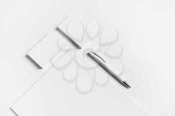Blank stationery set. Letterhead, business cards and pen on white paper background.