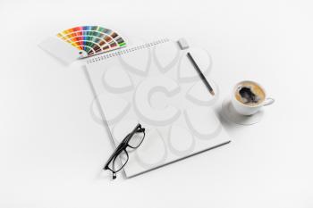 Blank notebook and stationery on white paper background. Mock up for placing your design.