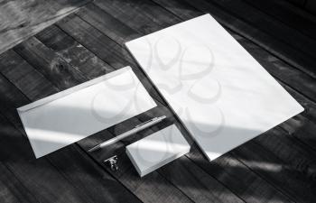 Brand identity template. Photo of blank corporate stationery set on wooden table background.