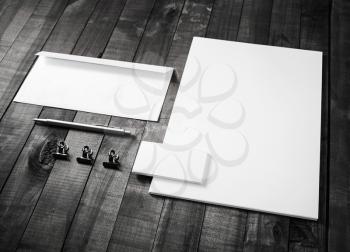 Set of blank stationery elements on wood table background. Branding template. Mockup for for placing your design.
