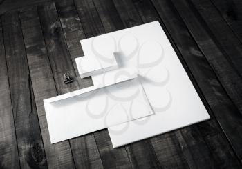 Blank corporate stationery on wood background. Branding template for placing your design.