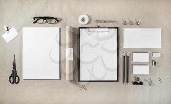Photo of blank stationery set on craft paper background. Responsive design mockup for placing your design. ID template. Top view.