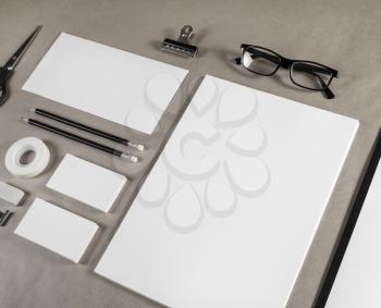 Photo of blank stationery and corporate identity template on craft paper background.