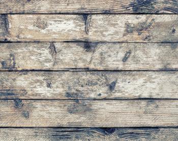 Old wood texture with knots. Weathered wooden planks background.