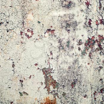 Old peeling paint background with cracks and rust. Grunge weathered texture.