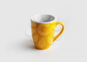 Blank yellow mug for coffee or tea. Cup mock-up.