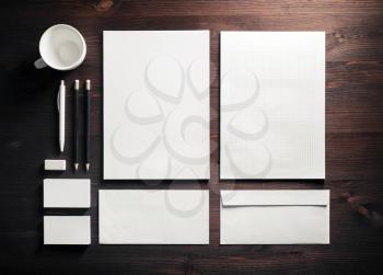 Blank stationery on wooden background. ID template. Mock-up for branding identity for designers. Top view. Flat lay.