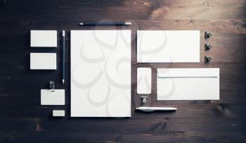 Blank stationery and ID template on wooden background. Mock-up for branding identity for designers. Top view. Flat lay.