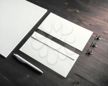 Blank stationery set on wooden background. Template for ID.