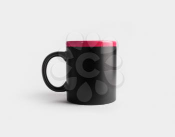 Blank black and red tea cup or coffee mug. Responsive design mockup.