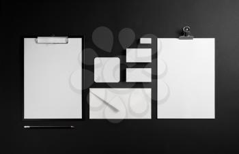 Branding stationery mockup on black paper background. Blank template for placing your design.