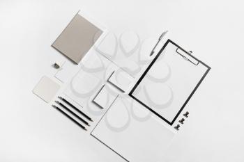 Photo of blank stationery set on paper background. Corporate identity mock up for placing your design. Top view.