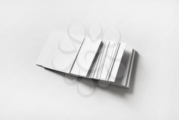 Many blank business cards on white paper background. Template for branding identity.