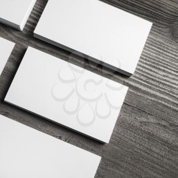 Blank white paper business cards with soft shadows. Mock up for ID.