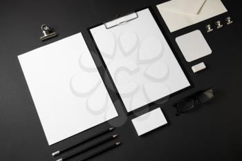 Blank stationery set on black paper background. Template for branding identity.