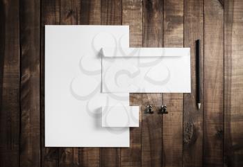 Blank stationery template on wood table background. Mock up for branding identity. For design presentations and portfolios. Flat lay.