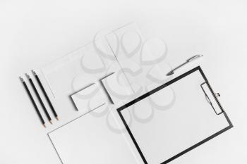 Corporate identity template. Photo of blank stationery set on white paper background. Responsive design mockup.