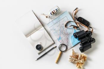 Overhead view of stationery, travel accessories and vacation items. Flat lay.