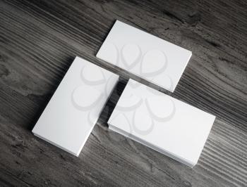 Photo of blank business cards on wood background. Top view.