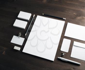 Corporate identity mockup. Blank stationery set on wood table background. Responsive design template.