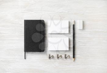 Photo of blank stationery set on light wood table background. Corporate identity mock up for placing your design. Flat lay.