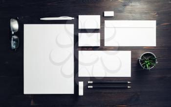 Blank stationery and corporate identity template on wooden background. Responsive design mockup. Top view. Flat lay.
