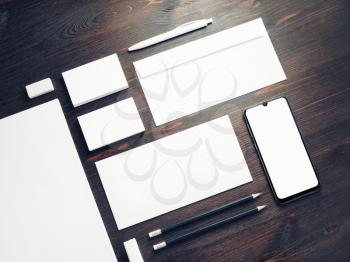 Corporate identity template on wooden background. Photo of blank stationery set. Mockup for design presentations and portfolios.